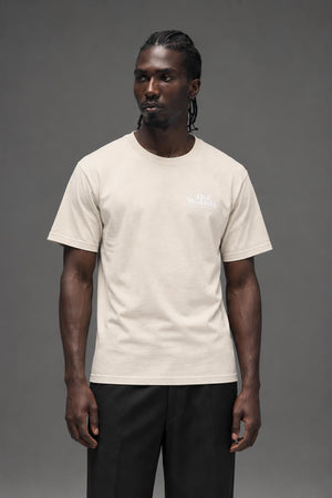 AI model photo - HUF Issues Logo Puff Short Sleeve Tee Unbleached TS01161