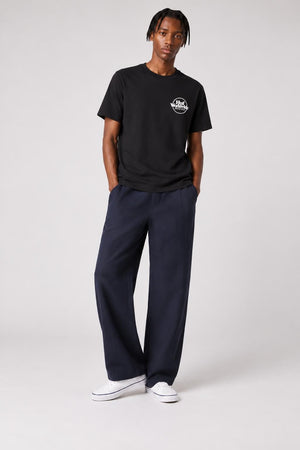 AI model photo - HUF Issues Logo Puff Short Sleeve Tee Black TS01161