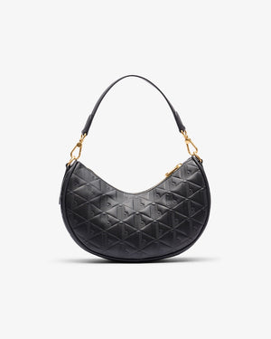 Black quilted handbag with gold accents on a white background