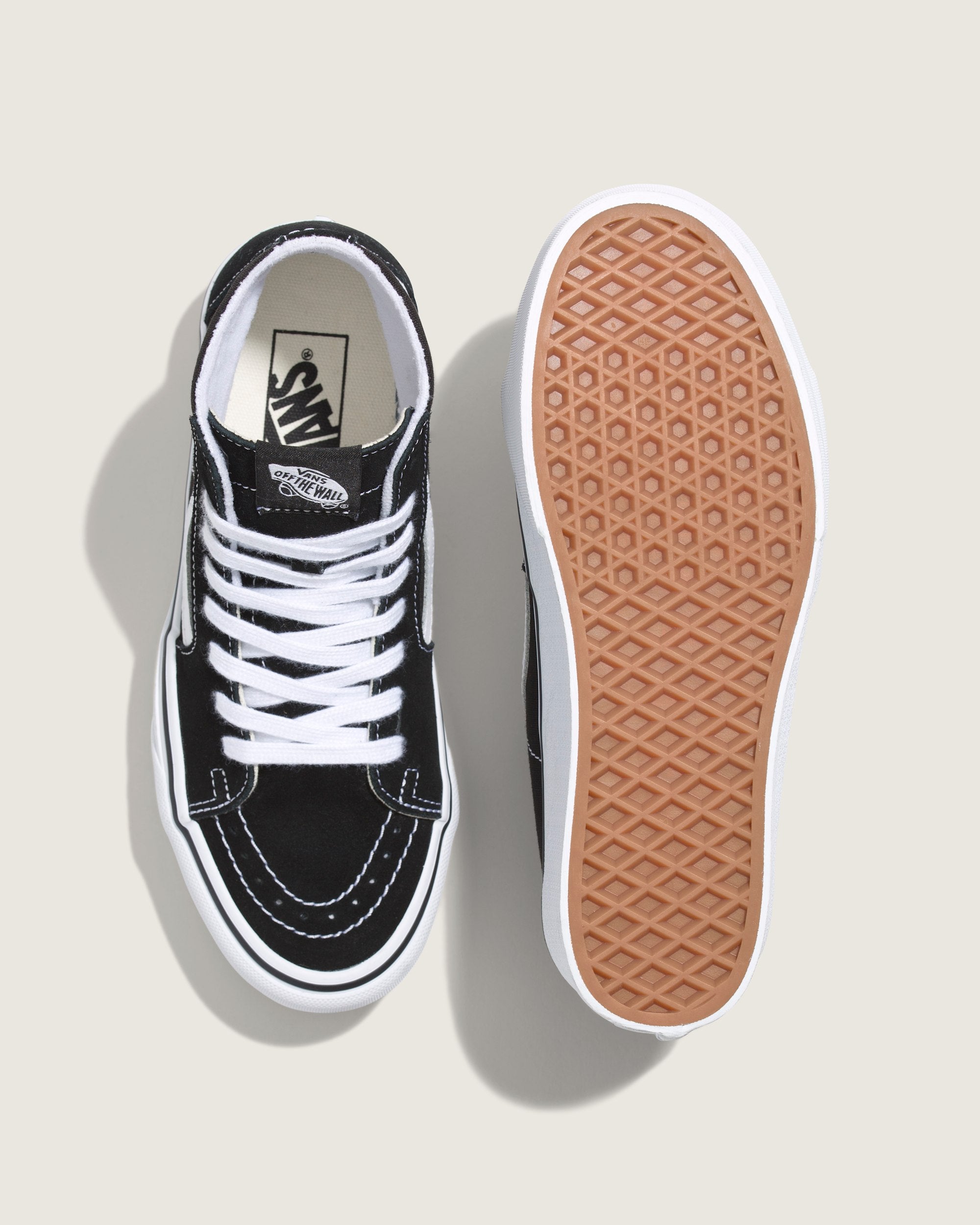 Top and waffle outsole views of Vans Sk8-Hi Tapered Platform Black/True White